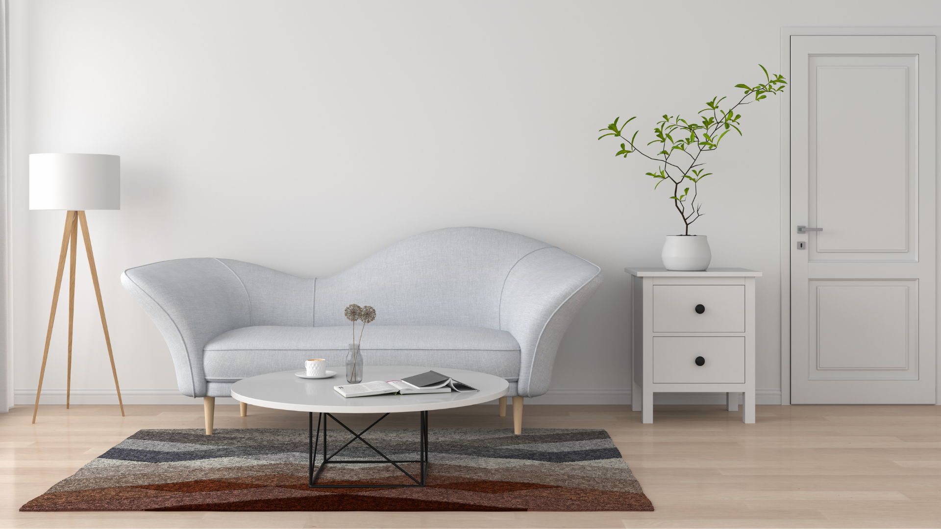 A modern living room featuring a light gray sofa, a round coffee table, a floor lamp, and a potted plant beside a white door.